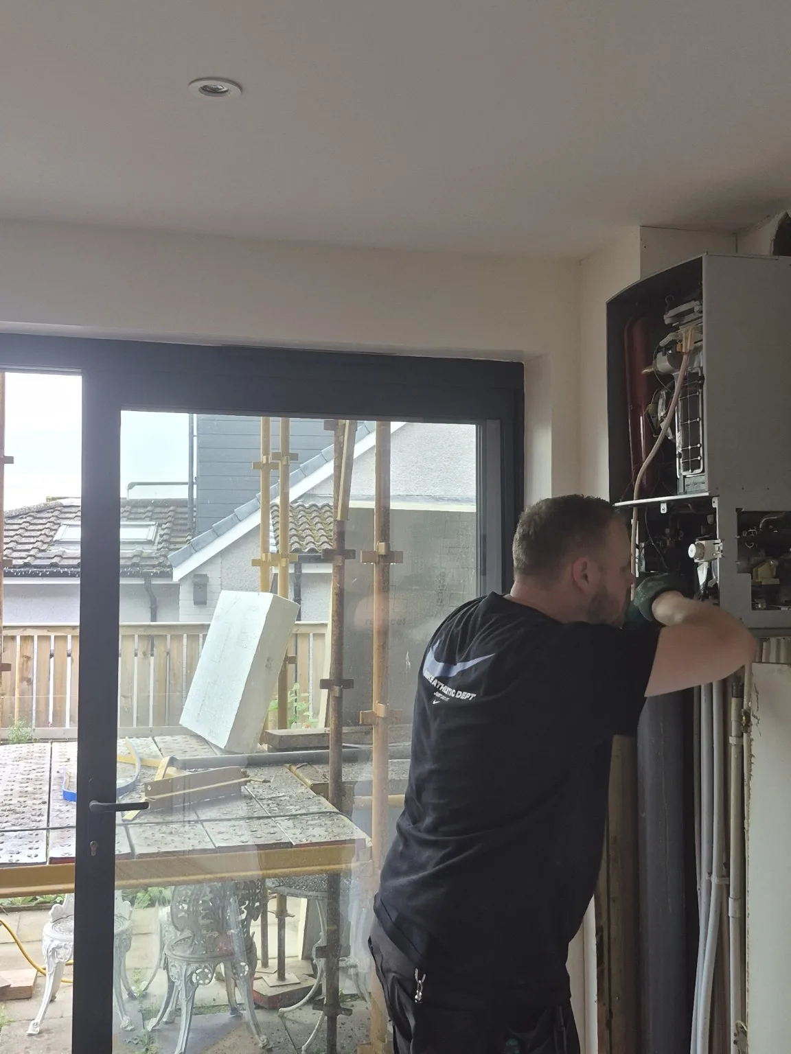 Older Worcester Bosch boiler being worked on during the removal stage