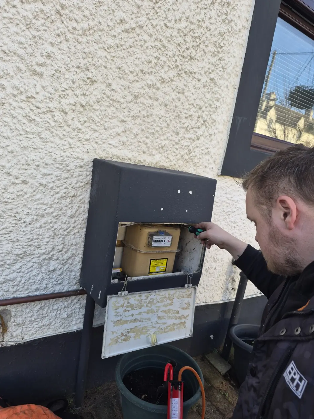 Gas testing equipment in use during an outdoor check