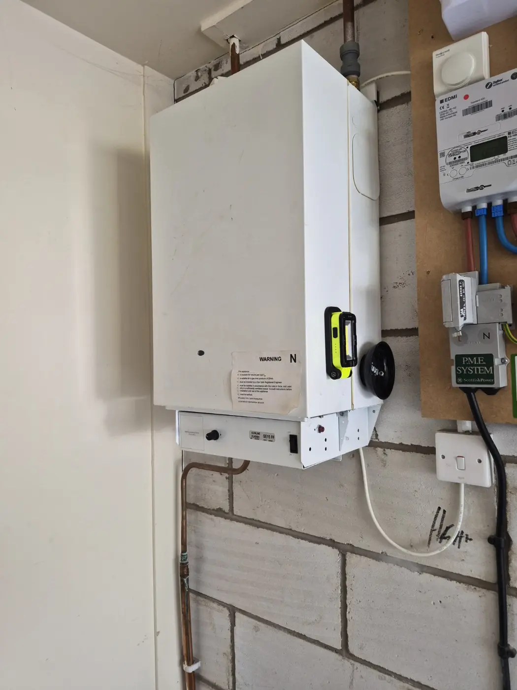 Completed boiler installation with tidy pipework